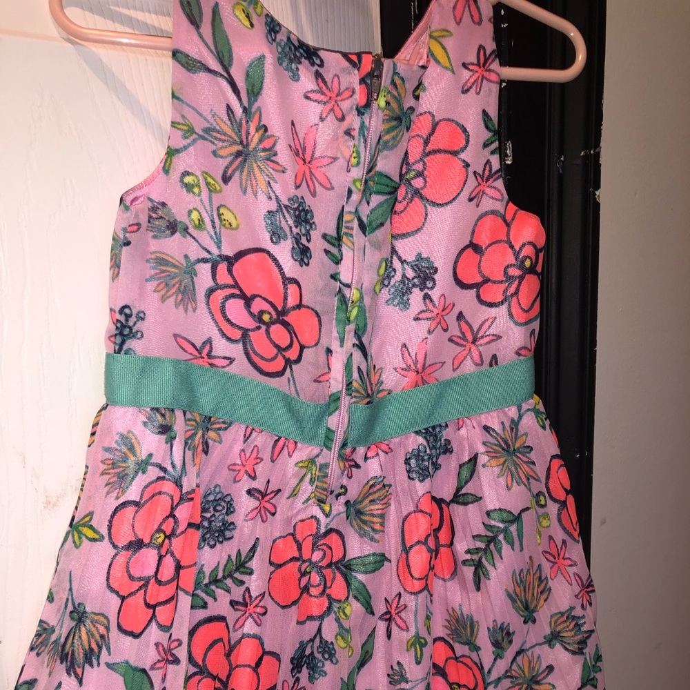 Little girls bright summer dress with flowers
